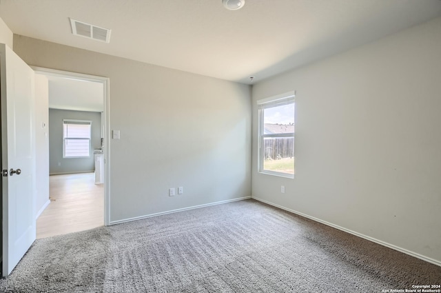 spare room featuring carpet