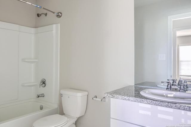 full bathroom featuring vanity, bathing tub / shower combination, and toilet