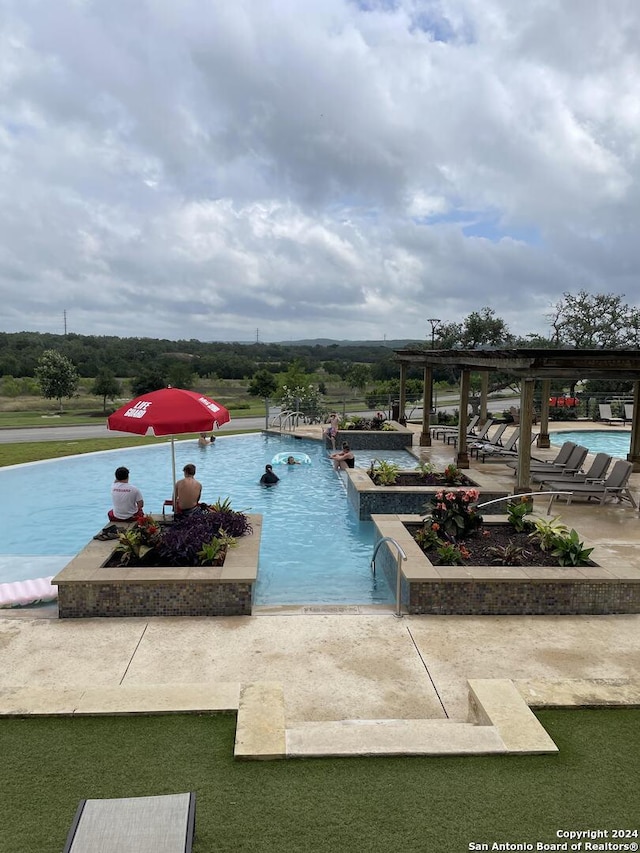 view of pool featuring a patio area