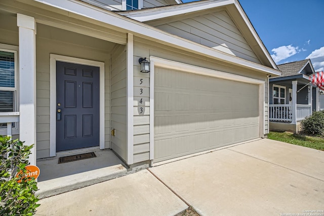 entrance to property featuring a garage