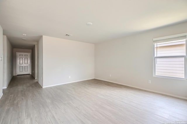 unfurnished room featuring light hardwood / wood-style flooring