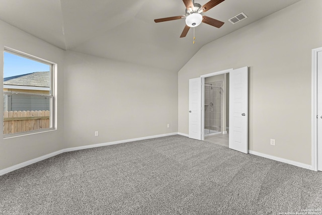 unfurnished bedroom featuring ceiling fan, carpet flooring, and vaulted ceiling