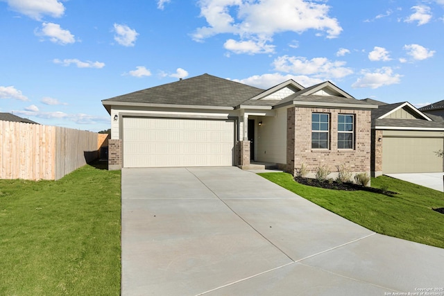 view of front facade with a garage and a front lawn