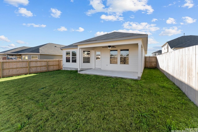 back of house featuring a patio area, a yard, and ceiling fan