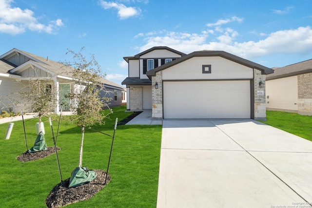 view of front of house featuring a garage and a front lawn