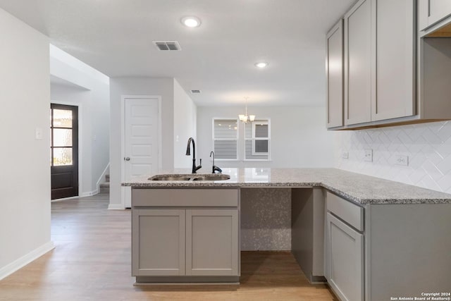 kitchen with gray cabinets and kitchen peninsula