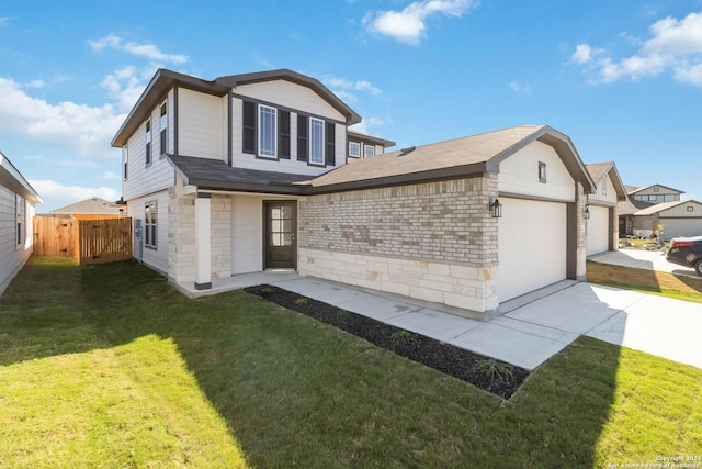 view of front facade featuring a garage and a front yard