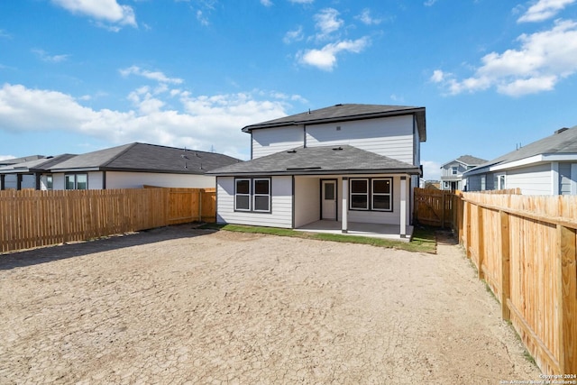 back of property featuring a patio area