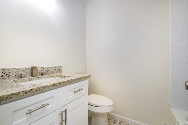 bathroom featuring toilet and vanity