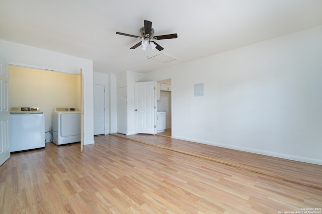 interior space with ceiling fan, washing machine and dryer, and light wood-type flooring