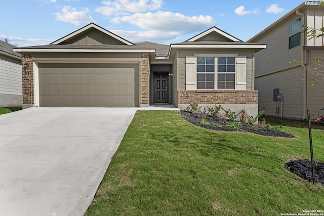 view of front of house featuring brick siding, an attached garage, board and batten siding, a front yard, and driveway