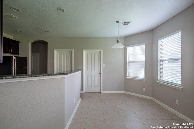 view of tiled spare room