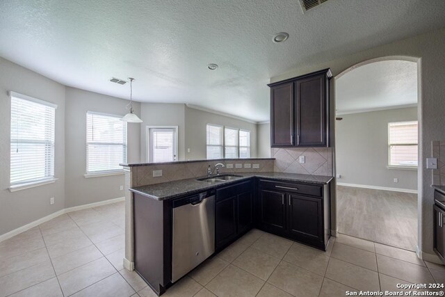 kitchen featuring light tile patterned flooring and plenty of natural light