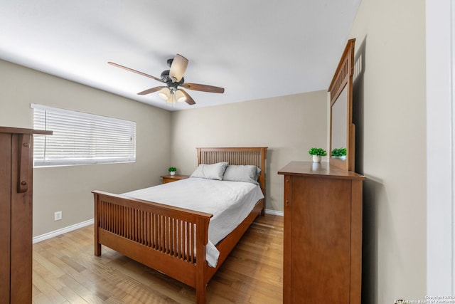 bedroom with light wood-type flooring and ceiling fan