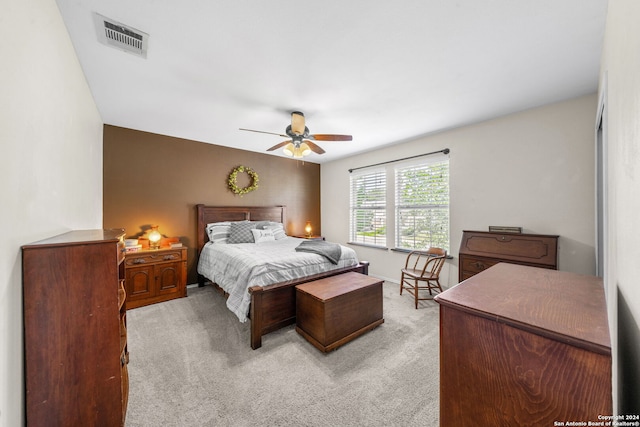 bedroom with light colored carpet and ceiling fan