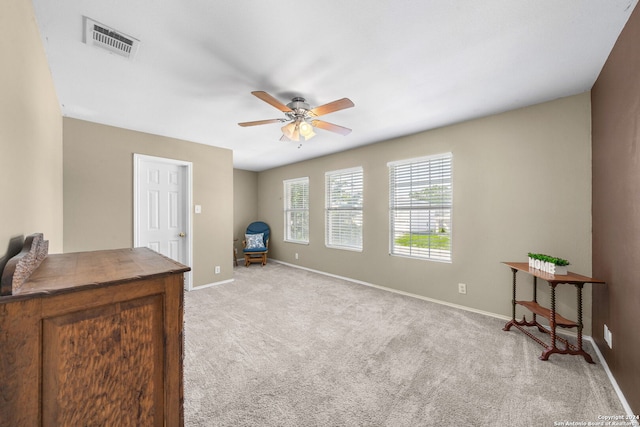 bedroom with ceiling fan and light colored carpet