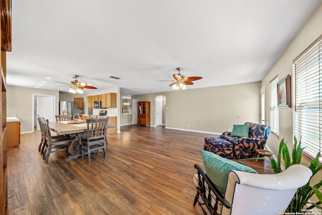 dining space featuring ceiling fan and hardwood / wood-style flooring