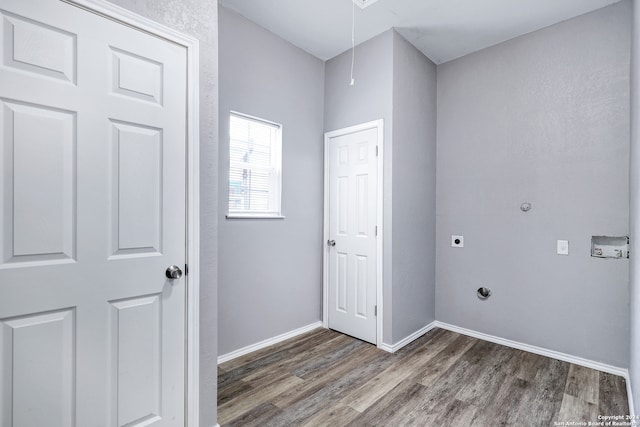 clothes washing area featuring hookup for an electric dryer and hardwood / wood-style floors