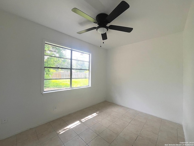 2205 Louise St, Seguin, TX 78155 - spare room with light tile patterned floors and ceiling fan