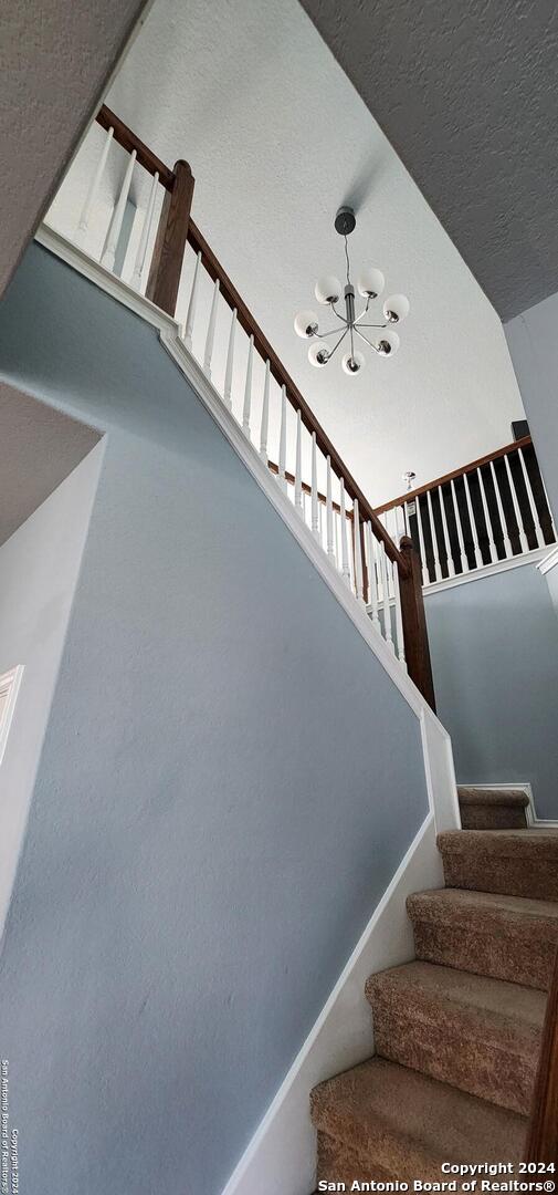 bedroom with light carpet and ceiling fan