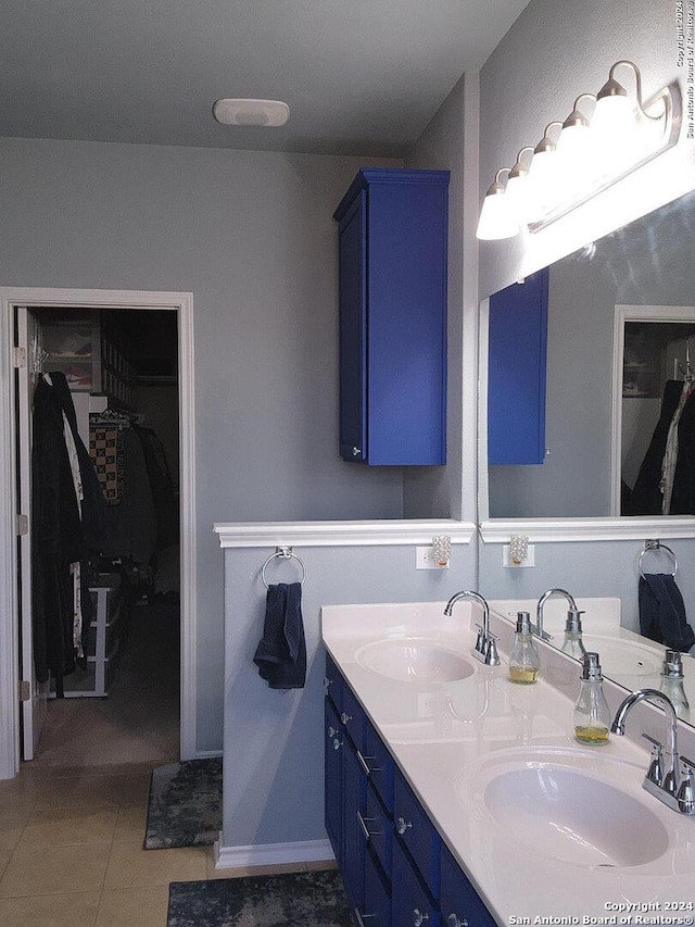 bathroom with vanity and tile patterned floors