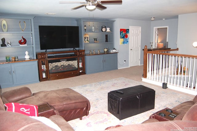 carpeted living room featuring ceiling fan and wooden walls