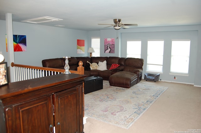 living room with ceiling fan and light carpet