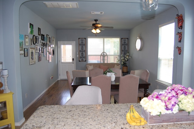 dining area featuring ceiling fan and dark hardwood / wood-style floors