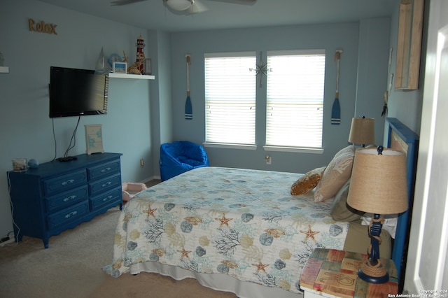 bedroom featuring ceiling fan and light carpet