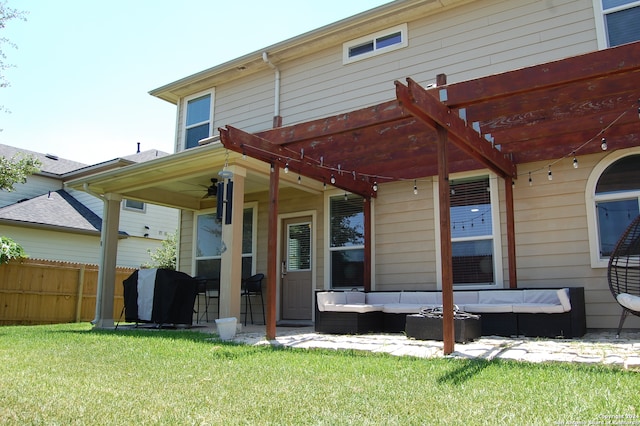 back of property with a pergola, a yard, and an outdoor hangout area