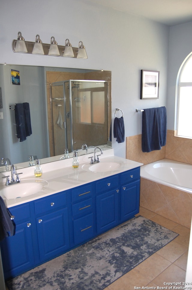 bathroom with vanity, tile patterned flooring, and separate shower and tub