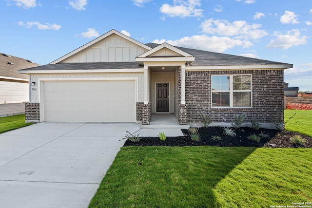 view of front of property featuring a garage and a front yard