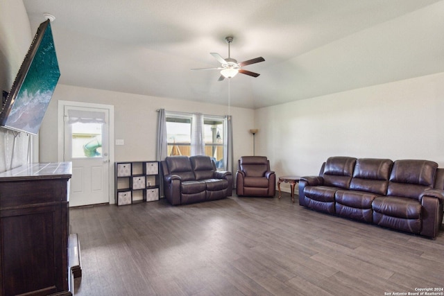 living room featuring lofted ceiling, wood-type flooring, and ceiling fan