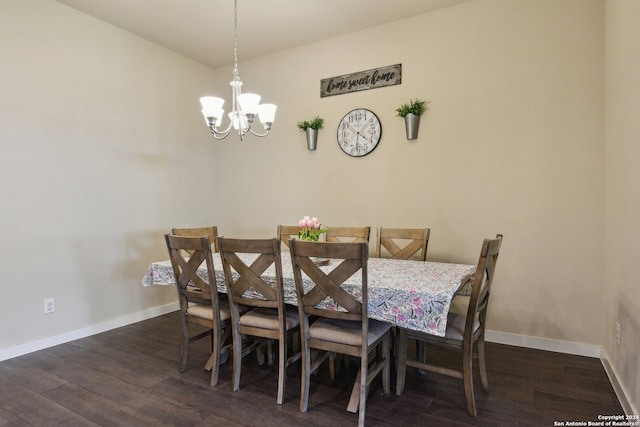 dining room with a notable chandelier and dark hardwood / wood-style floors