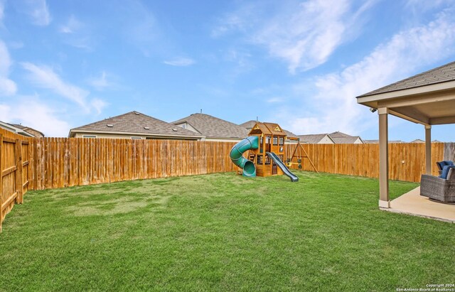 view of yard with a playground