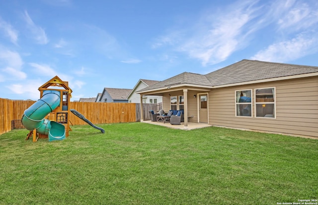 exterior space with a playground, a patio, and a yard