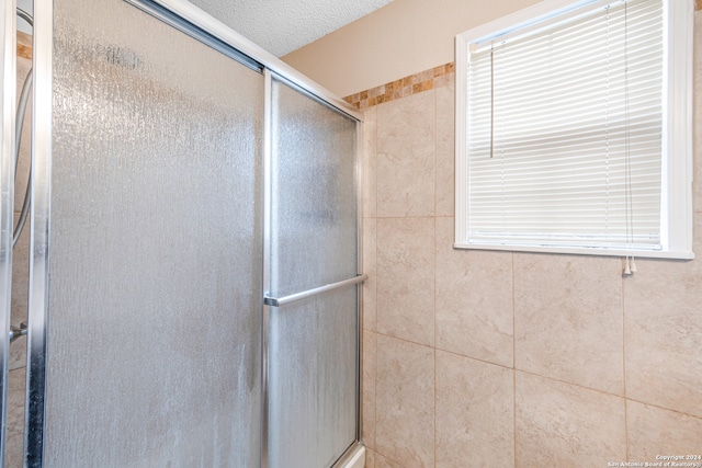 bathroom with an enclosed shower