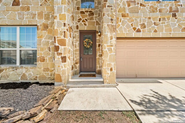 doorway to property featuring a garage