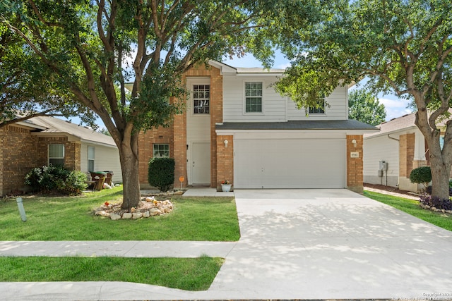 view of front of house with a garage and a front yard