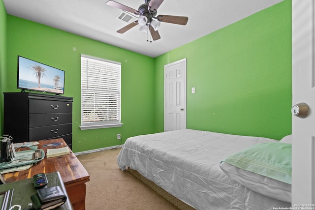 bedroom featuring ceiling fan and carpet flooring