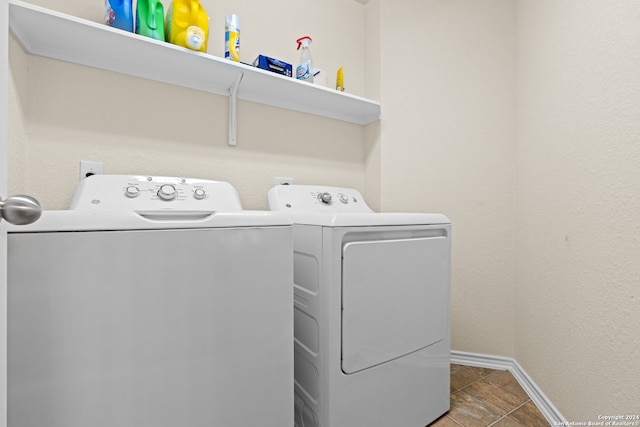 washroom with washing machine and dryer and tile patterned floors