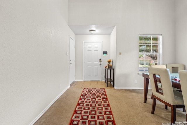 view of carpeted foyer entrance