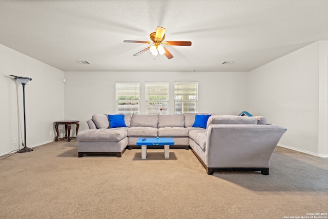 living room featuring light carpet and ceiling fan