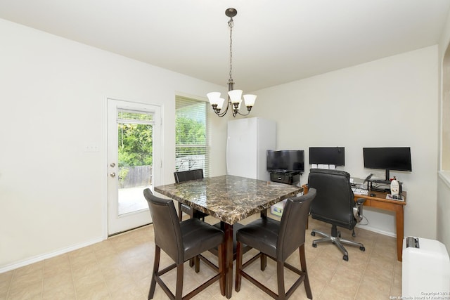 dining room featuring a chandelier