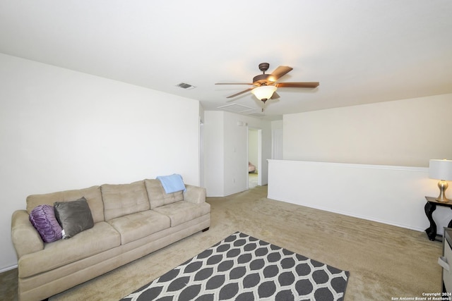 living room featuring ceiling fan and light colored carpet