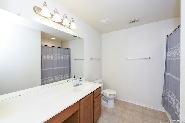 bathroom featuring vanity, a shower with curtain, and toilet