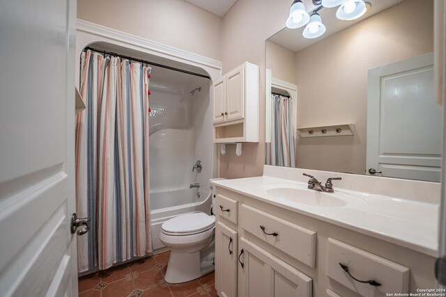 full bathroom with tile patterned floors, toilet, vanity, and shower / tub combo with curtain