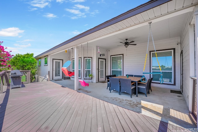 deck featuring a grill and ceiling fan