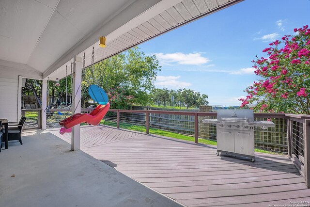 wooden terrace with area for grilling