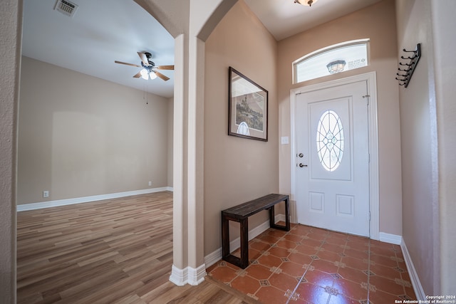 entryway featuring wood-type flooring and ceiling fan